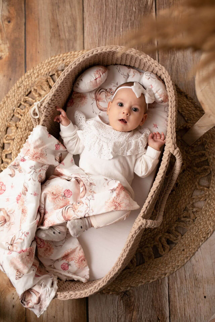 Baby girl in a latte handmade crochet moses basket